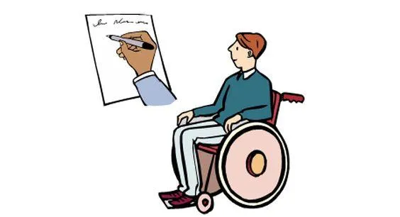 Ein Mann im Rollstuhl, daneben ein Zettel, auf dem etwas geschrieben steht.