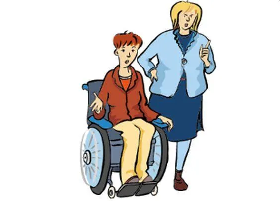 Eine Frau im Rollstuhl, daneben steht eine andere Frau und hebt den Zeigefinger.