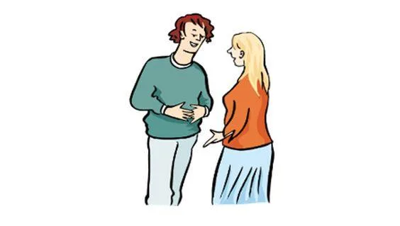 Ein Mann und eine Frau stehen sich gegenüber und sprechen miteinander.