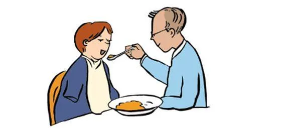 Ein Mann hilft einer Frau beim Essen.