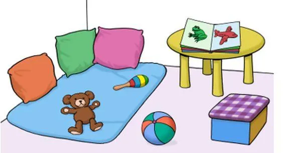 Eine Spielecke mit Decke, Kissen und Spielzeug.