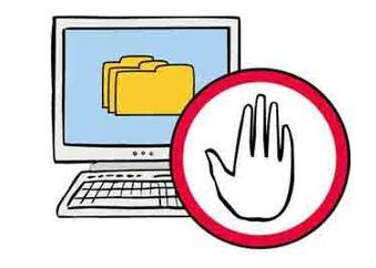 Ein Computer mit Bildschirm, daneben ein rotes Schild mit einer erhobenen Hand.